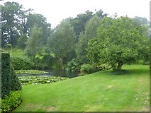 ST0519 : Lake and gardens at Holcombe Court in heavy rain by David Smith