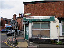 SJ8989 : Derelict shop on a Stockport corner by Jaggery