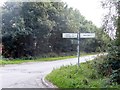 Old road direction sign