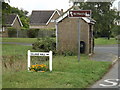 TL8972 : Village Hall sign & Bus Shelter by Geographer