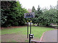 Graffiti-covered notice in Bournbrook Recreation Ground, Selly Oak, Birmingham