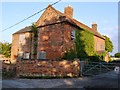 Boarded up farmhouse in Slack