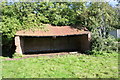 Brick cowshed beside telecoms mast at Lodge Farm