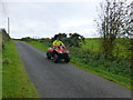 H3572 : Farmer on quad bike, Magharenny by Kenneth  Allen