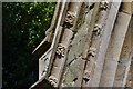 West Ashby, All Saints Church: C19th restoration rosettes  on c15th gabled porch