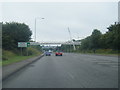 A38 crossed by a footbridge