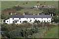 Three cottages painted white as a daymark