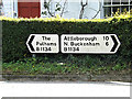 TM1587 : Roadsigns on the B1134 Station Road by Geographer
