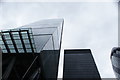 View of the Aviva building reflected in the Cheese Grater from Leadenhall Street