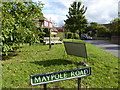 Village sign and seating