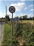 TM1389 : Tibenham Village Name sign on Hill Road by Geographer
