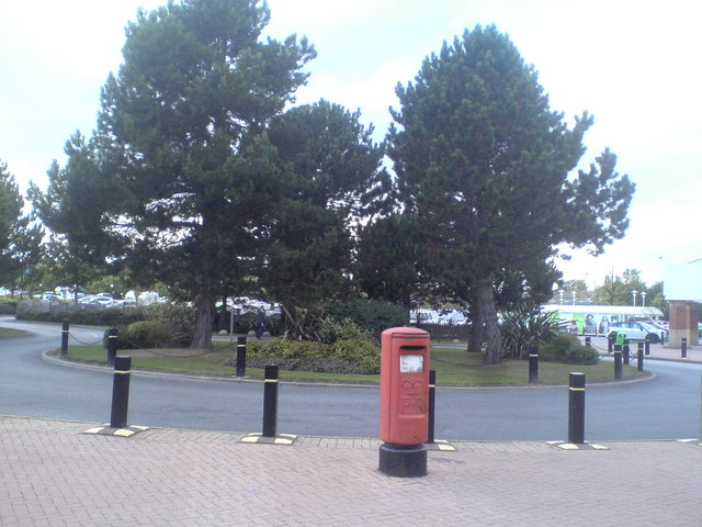 Roundabout and postbox at Owlcotes Centre near Pudsey
