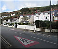 Warning signs painted on the A493 in Aberdovey