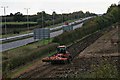 Life in the slow lane: tractor parallel to the A46 near Thorpe on the Hill