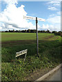 Signpost & Mile Road sign