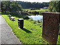 Commemorative board by footpath by River Eden