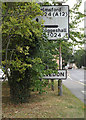 TL8619 : Roadsign & Kelvedon Village Name sign by Geographer