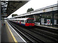 Piccadilly line train passing through Turnham Green