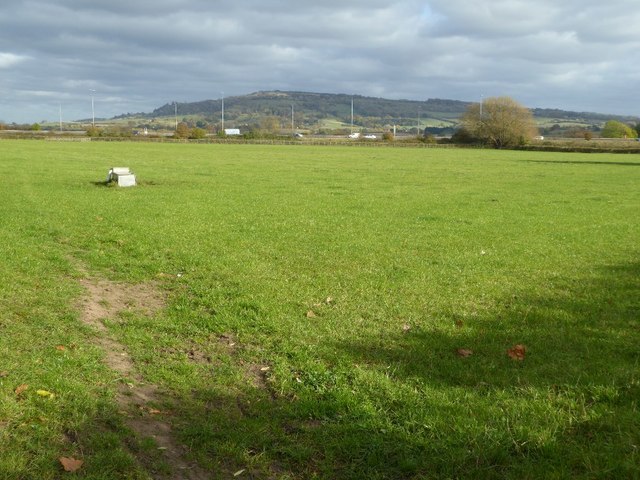 View across a field to Bredon Hill