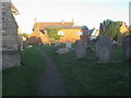 SP7731 : Churchyard of St James's Church by Shaun Ferguson