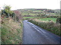 J1122 : Burren Hill road descending from the cross roads by Eric Jones