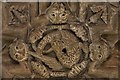 Iffley, St. Mary the Virgin Church: Chancel roof boss, dragon framed by beasts and fir cones 1