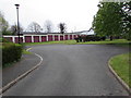 Long row of lockup garages behind the Sheldon Avenue turning circle, Broadway