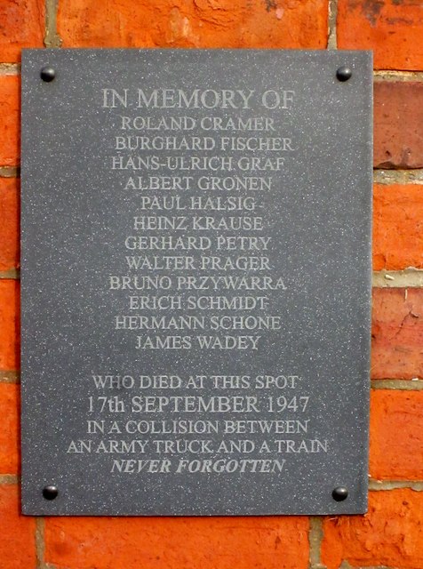 Plaque  on  the  wall  of  small  railway  building