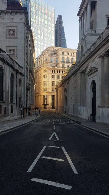 Sunlit building at the east end of Lothbury