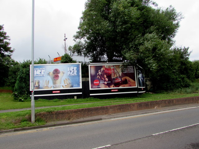 Ice Age and Coca Cola adverts facing Docks Way, Newport