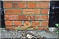 Benchmark on garages on Harewood Avenue