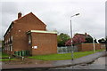 Standish House and outbuilding by bus stop