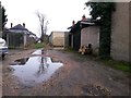 SZ1392 : West Southbourne: puddles on footpath H10 by Chris Downer