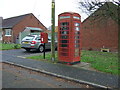 Elizabeth II postbox and telephone box on South Croft, Spurstow