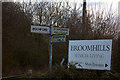 Signpost and Broomhills sign