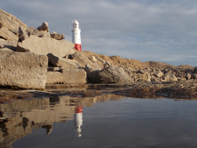 Bill of Portland: the lighthouse is reflected