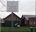 Bilingual notice at the edge of school grounds, Flint