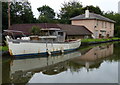 Old boat moored along the Grand Union Canal