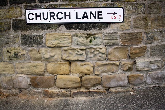 Benchmark under Church Lane name sign