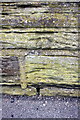 Weathered benchmark on wall of Harrogate Road outside LiDL