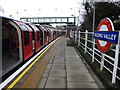 TQ4192 : A Central line train at Roding Valley station by Marathon