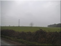 TL0811 : Field and pylons by Gaddesden Lane by David Howard