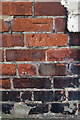 Benchmark on wall outside #4 Upper Westbrook