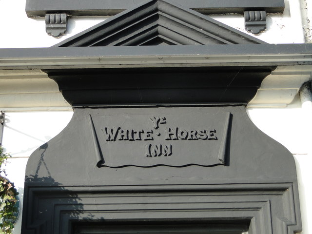 Above the door of 'Ye White Horse Inn'