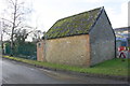 Small building at factory entrance NE of river bridge