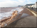 SY1287 : Sidmouth Esplanade, waves on shingle at high tide  by David Hawgood