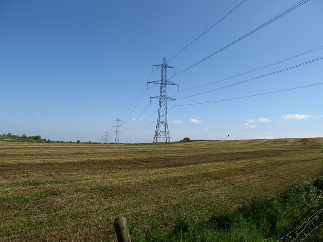 The North-South Interconnector crossing a harvested hay field north of Coiners Lane
