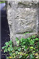 Benchmark on railway bridge near Stoop House Farm