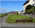 Roadside wooden bench in Tywyn