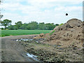 TL7028 : Parkend Lane curving round manure heap by Robin Webster